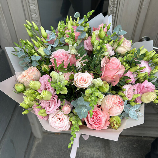 Bouquet with roses, spray roses, lisianthus and eucalyptus by Rīgas Ziedi florists