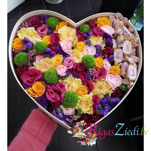 Flower composition in heart box with Geisha candies